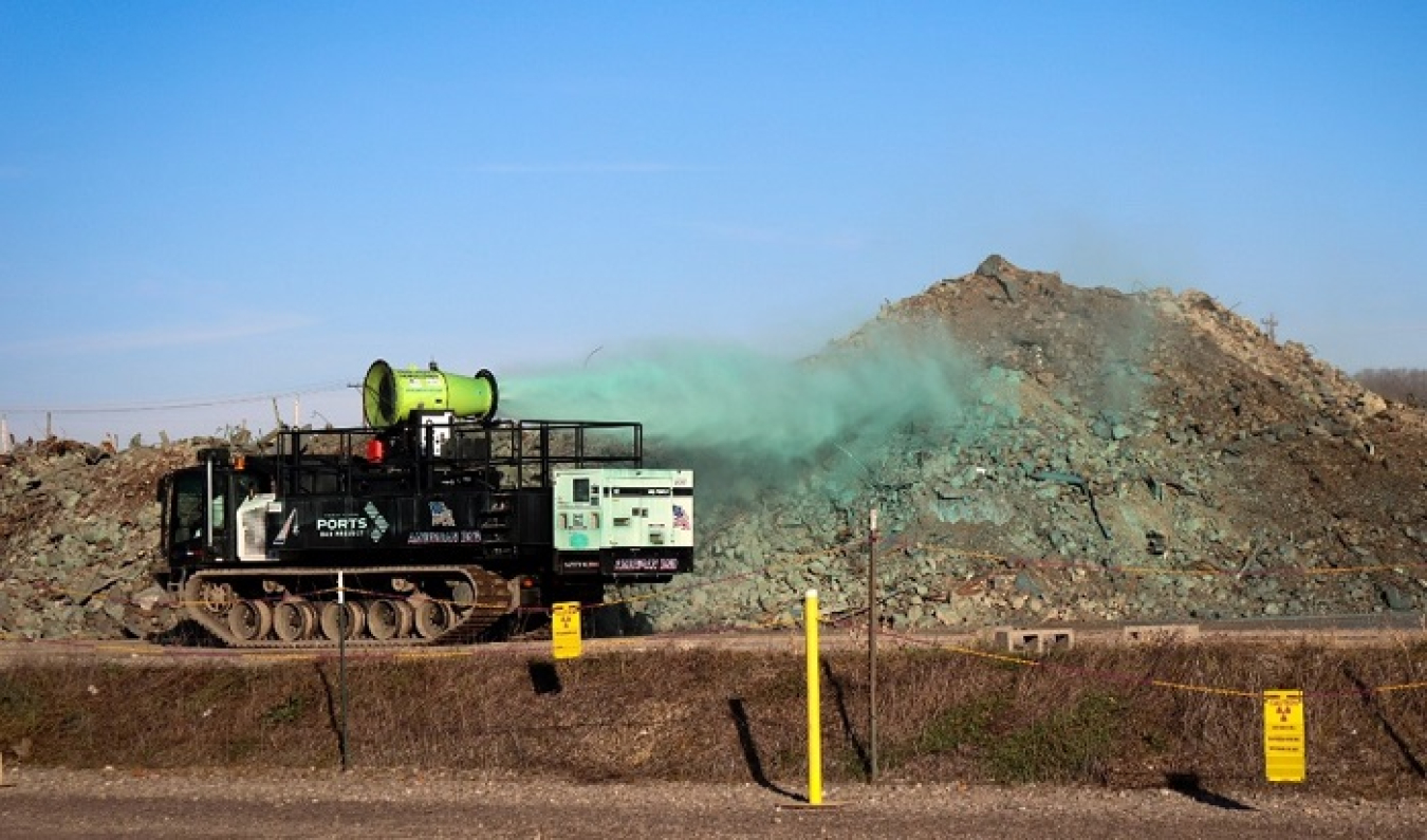 The Panther T16 sprays fixative with a high-pressure water cannon onto X-326 building debris at the Portsmouth Site. 