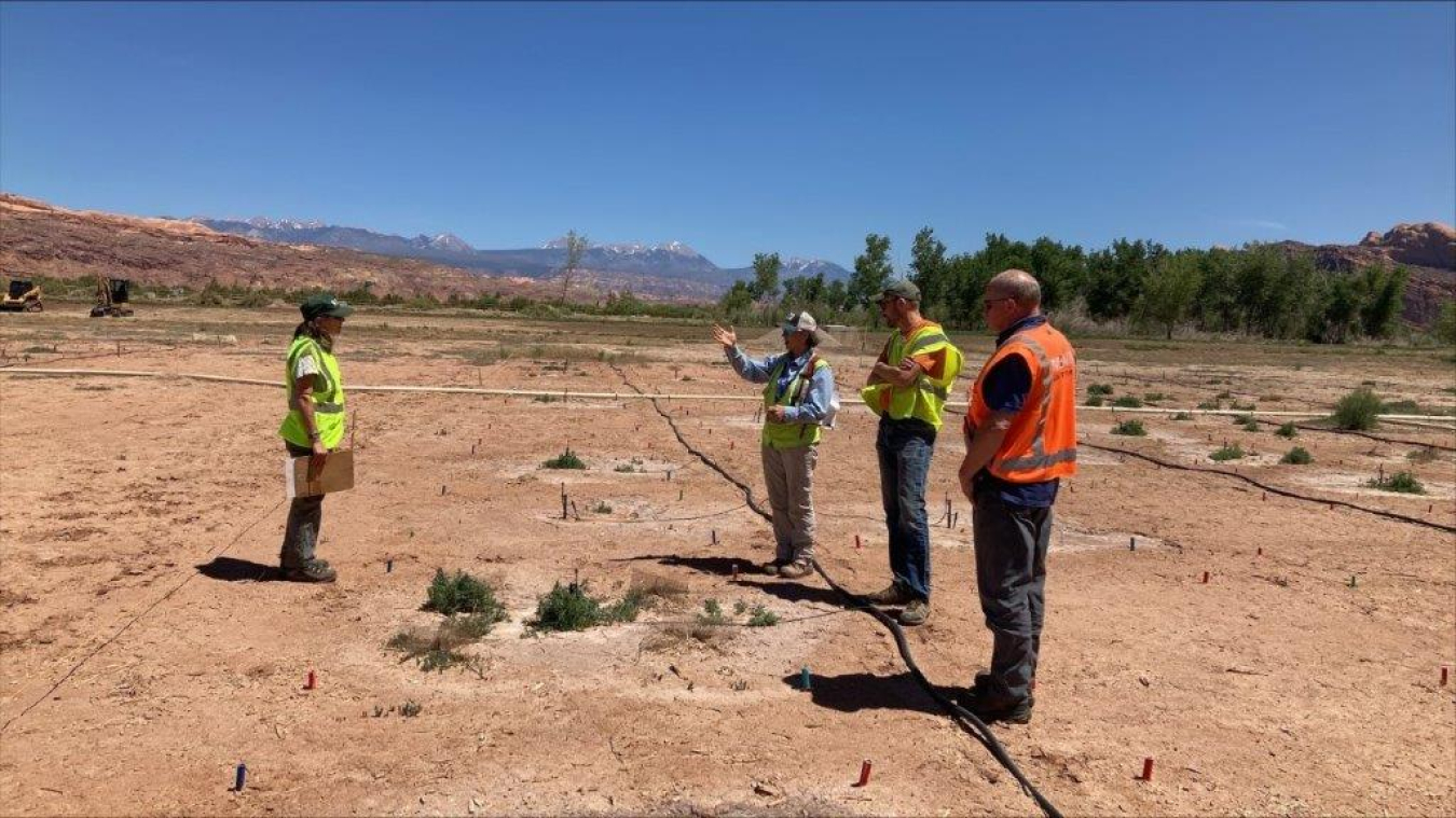 Moab Uranium Mill Tailings Remedial Action Project Federal Cleanup Director Russell McCallister, right, looks on as Moab Site Revegetation Manager Katrina Lund, an EM contractor.