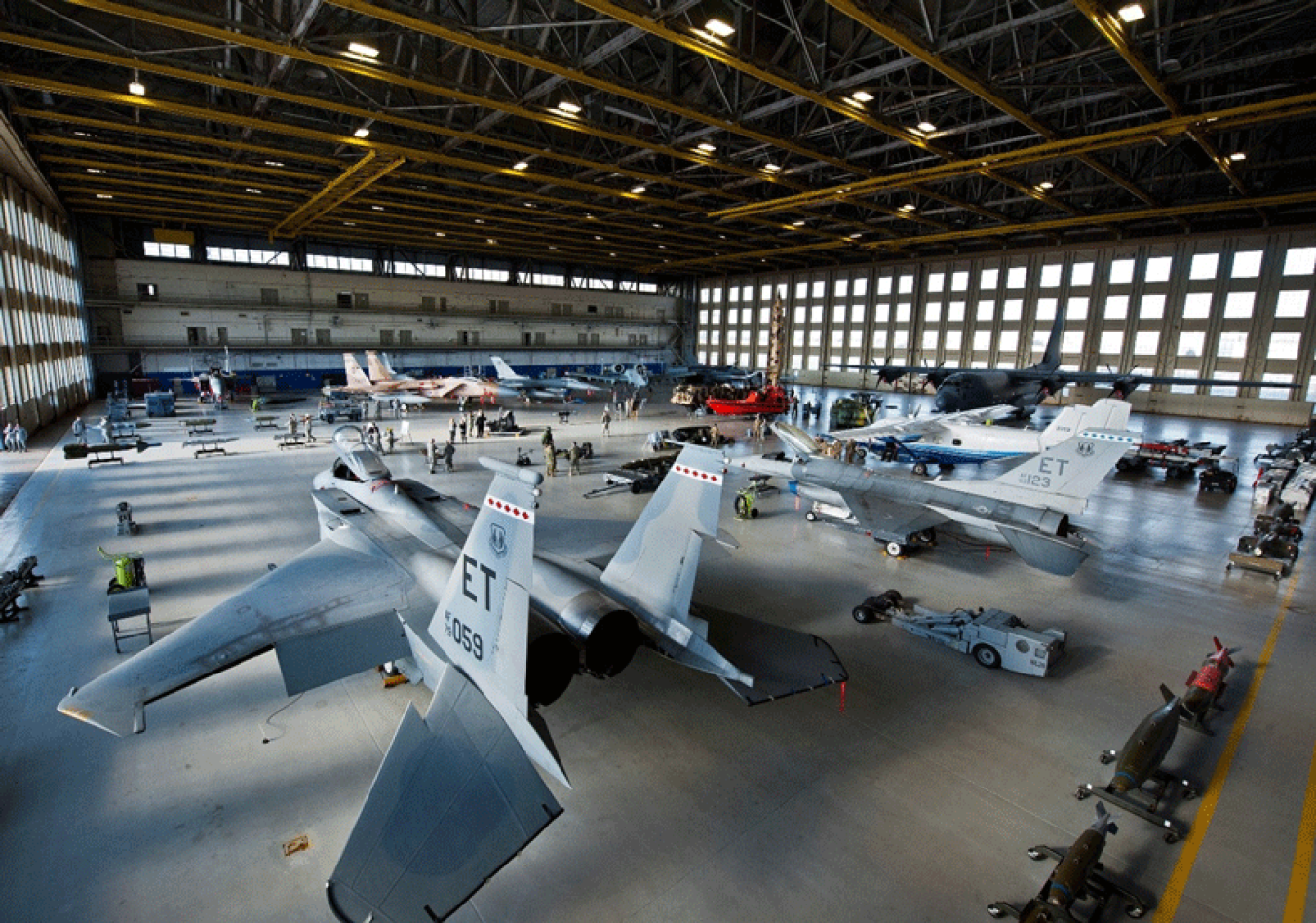 A hangar filled with planes.