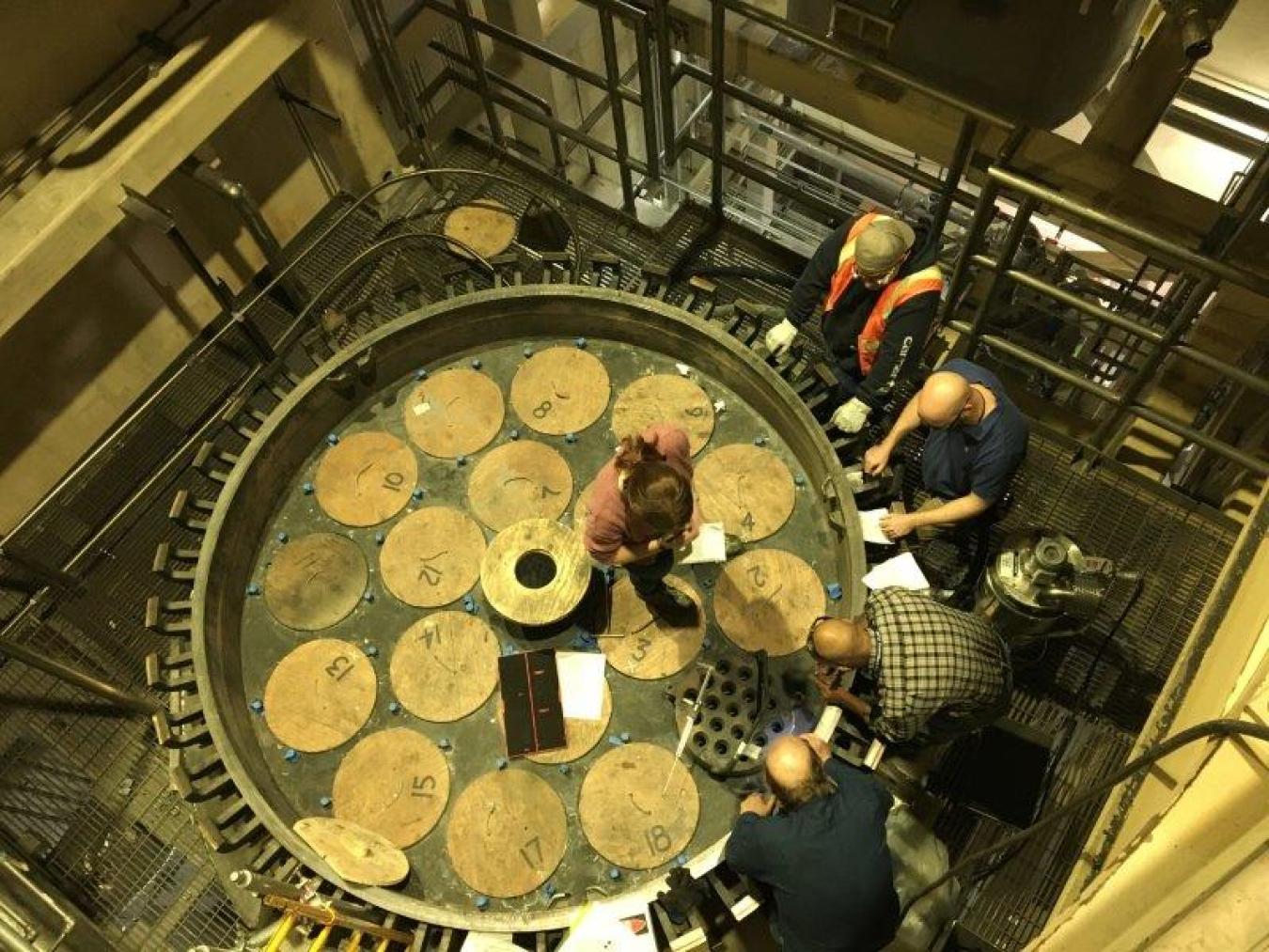 A crew inspects the Integrated Waste Treatment Unit’s Process Gas Filter before the current confirmatory run. 