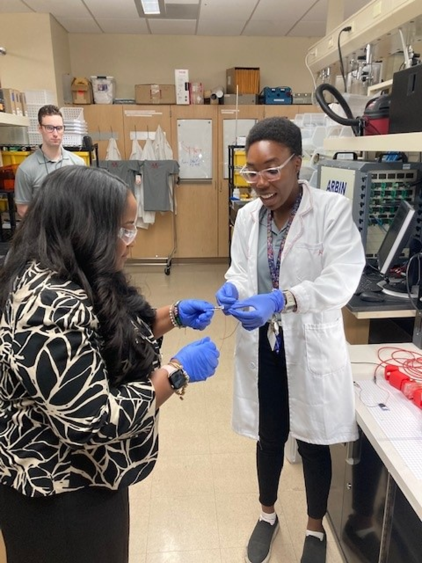 Alexandrea Washington, a doctoral student, demonstrates a new smart material that she has been studying.