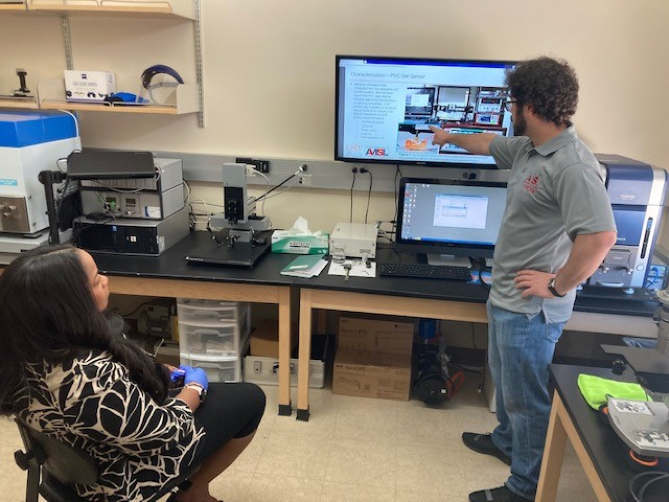 Doctoral student John Faccinto, gives Nelson-Jean a presentation on “Wearable Soft-Robot Systems for Enhanced Worker Capability and Safety.”