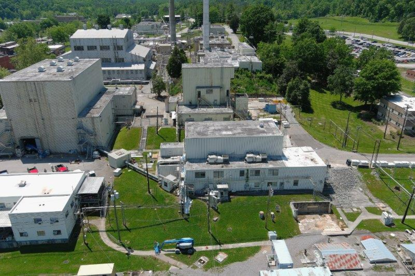 An aerial view of the central campus area at Oak Ridge National Laboratory that the Oak Ridge Office of Environmental Management will be transforming in the months ahead. Demolition is scheduled to begin on Building 3010 (front right) this fall followed by Building 3005 (back right) later this year. Crews are also conducting cleanup projects in Building 3042 (left).