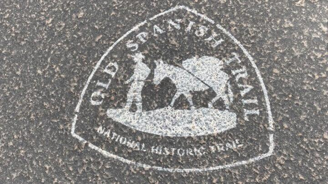 The official Old Spanish Trail logo is stamped on “silhouettes” commemorating the historic trail. 