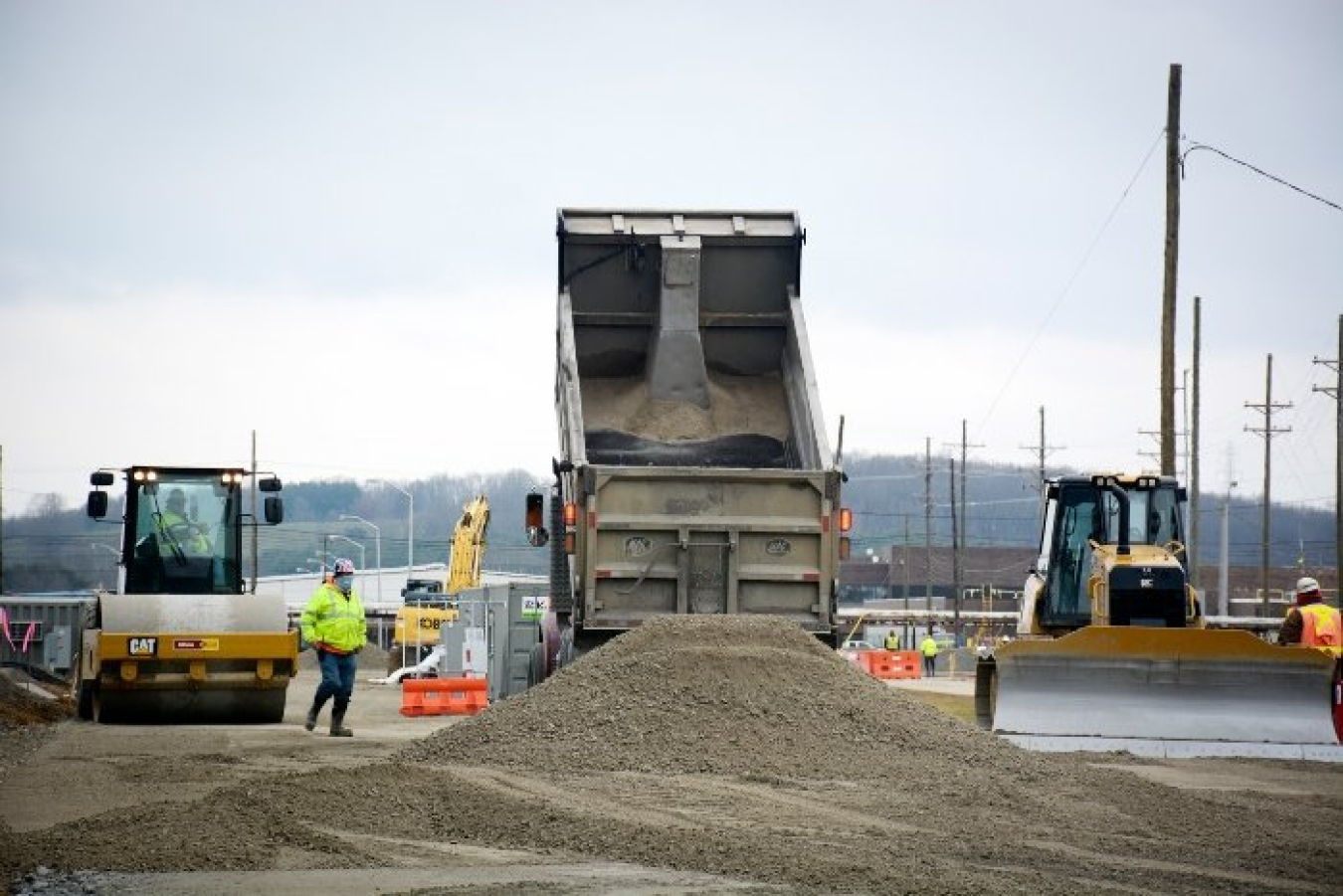 Fluor-BWXT Portsmouth crews deliver a load of dirt near the X-326 building at the Portsmouth Site as work continued on haul road construction.