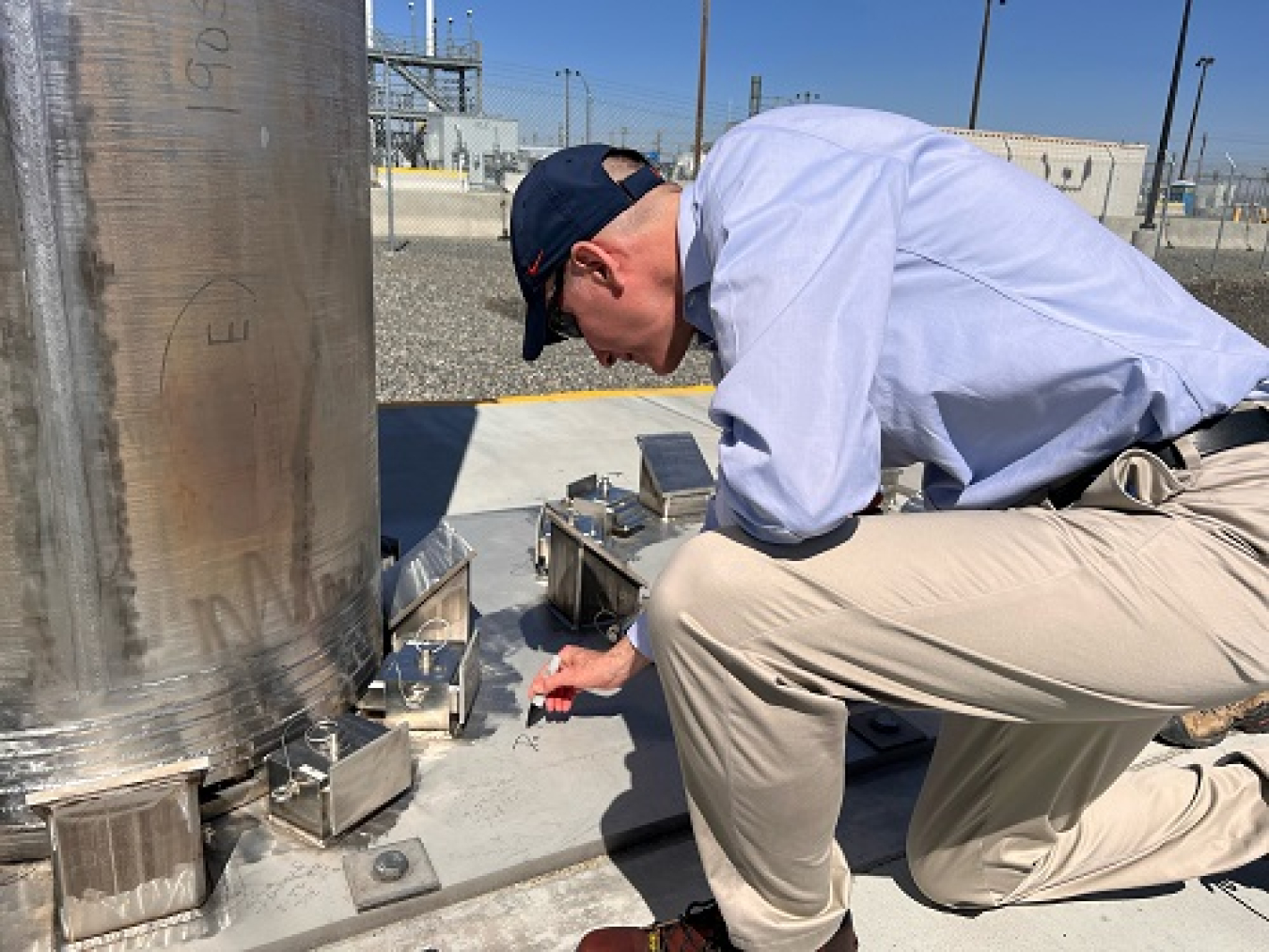 During a visit to the Hanford Site on June 28, Deputy Energy Secretary David Turk signed his name on concrete next to a shielded container to mark progress in treating waste from the Hanford Site’s underground tanks with the Tank-Side Cesium Removal System.