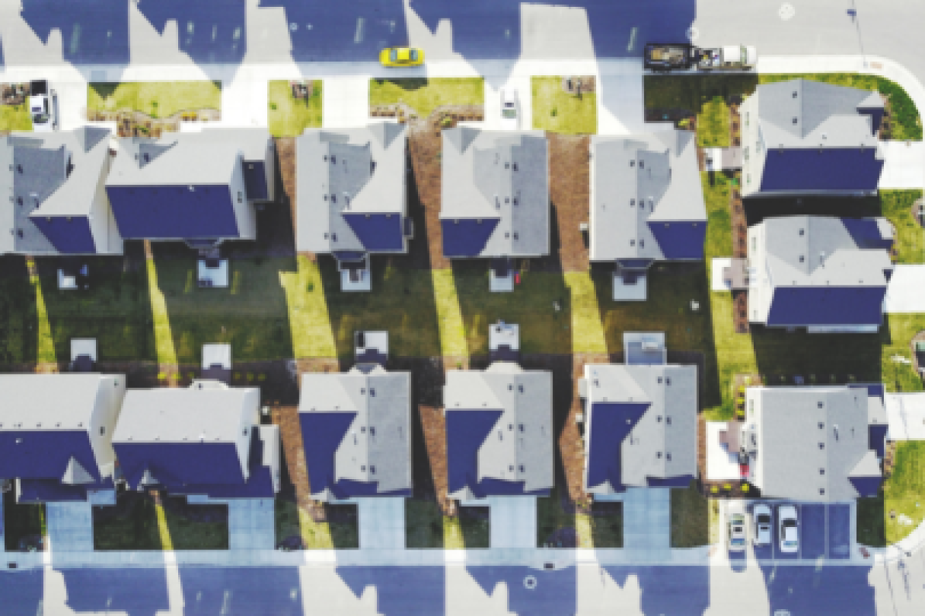 Overhead photo of rows of houses in a neighborhood.