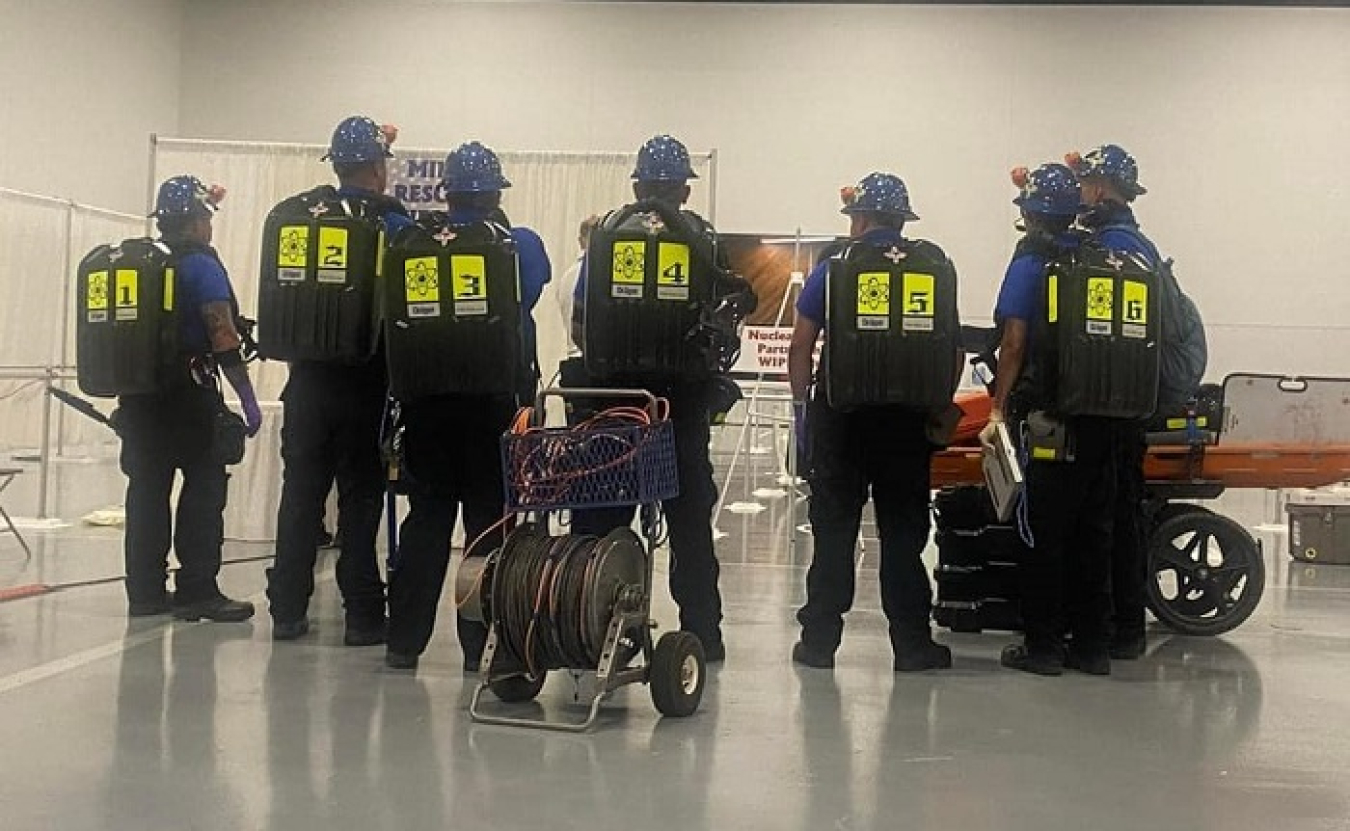 The Waste Isolation Pilot Plant Blue Mine Rescue Team participates in a final briefing before beginning a field contest in a recent national mine rescue competition.