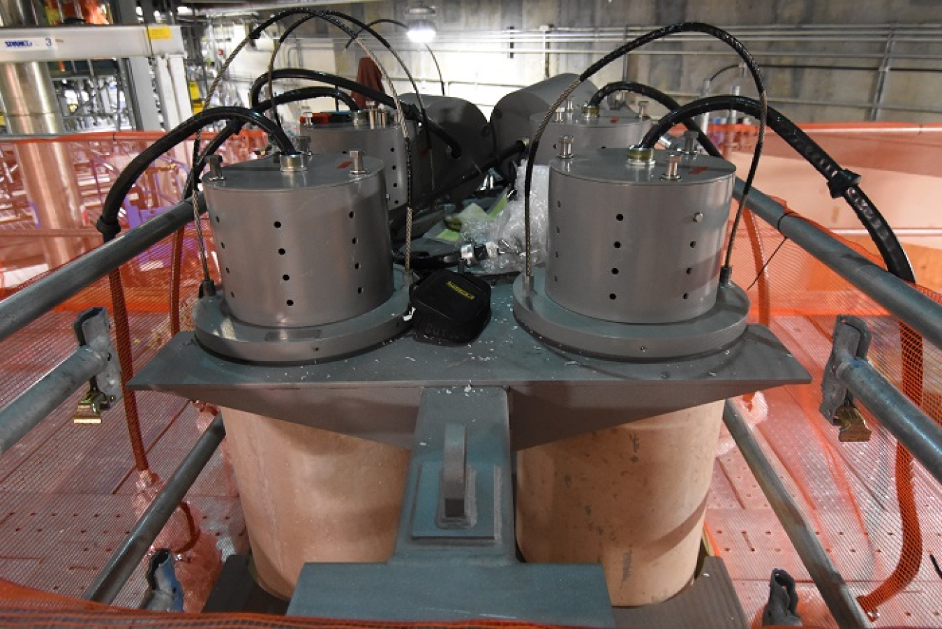 Temporary startup heaters rest in a storage rack as they are prepared for installation into a melter.