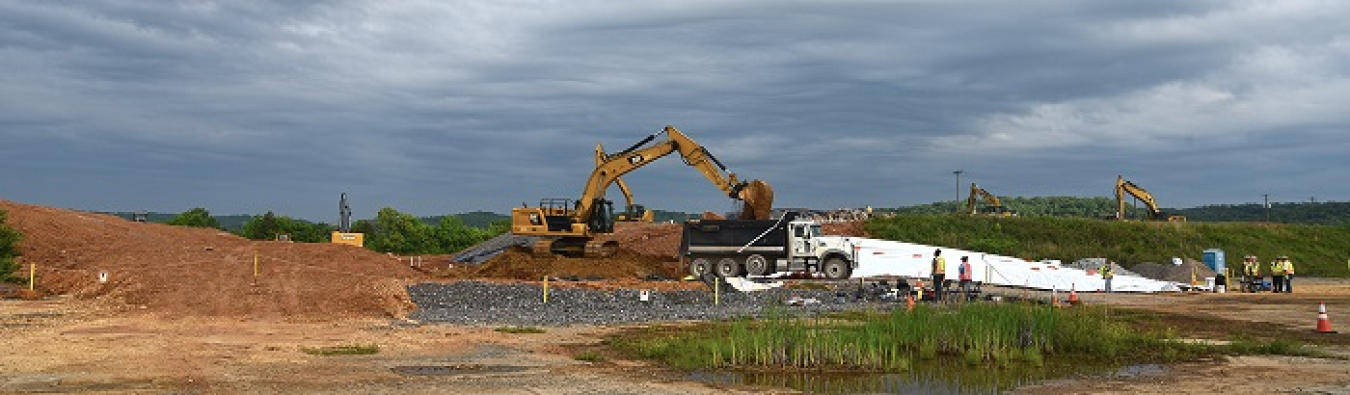 Soil removed from the former K-25 building area at Oak Ridge is being loaded into a truck that will transport it for disposal.