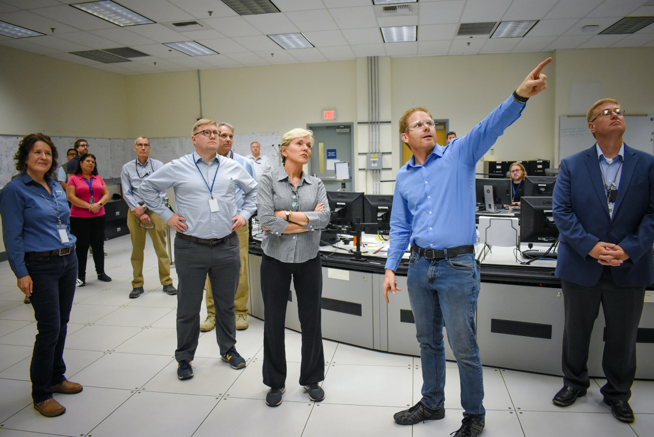 Energy Secretary Jennifer Granholm is briefed by Tom Fletcher, EM assistant manager of the Waste Treatment and Immobilization Plant at the Hanford Site, in the control room of the Low-Activity Waste Facility on monitors that display the status of equipment and the facilities to technicians who manage the plant.