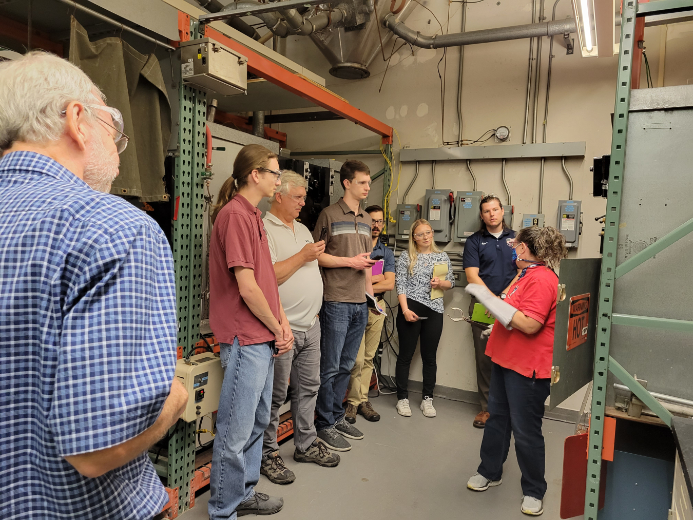 Andrea Kidder, right, a lab supervisor at the Vitreous State Laboratory at The Catholic University of America in Washington, D.C., talks with Hanford Site Waste Treatment and Immobilization Plant operations and commissioning team members during their recent lab visit.