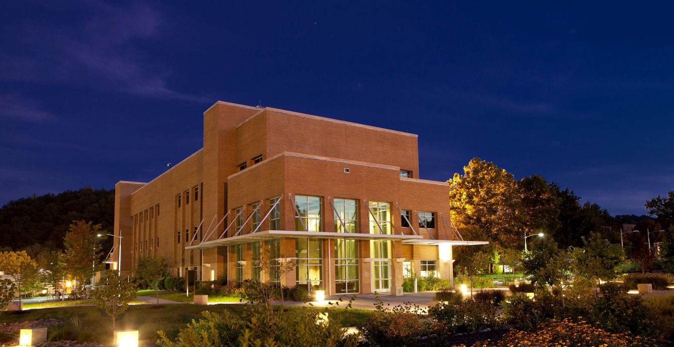 Brightly lit commercial building at night: Joint Institute for Biological Sciences (JIBS) Building, which houses Bioenergy Science Center (BESC) offices and laboratories at Oak Ridge National Laboratory.