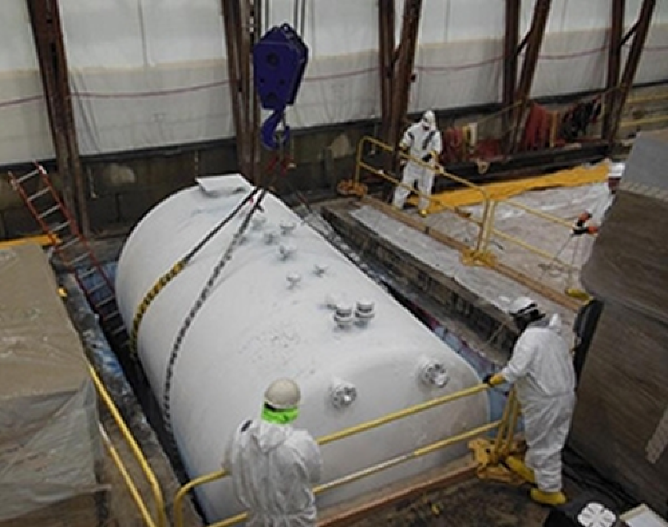 Removal of one of nine 10,000-gallon tanks from Building H2.