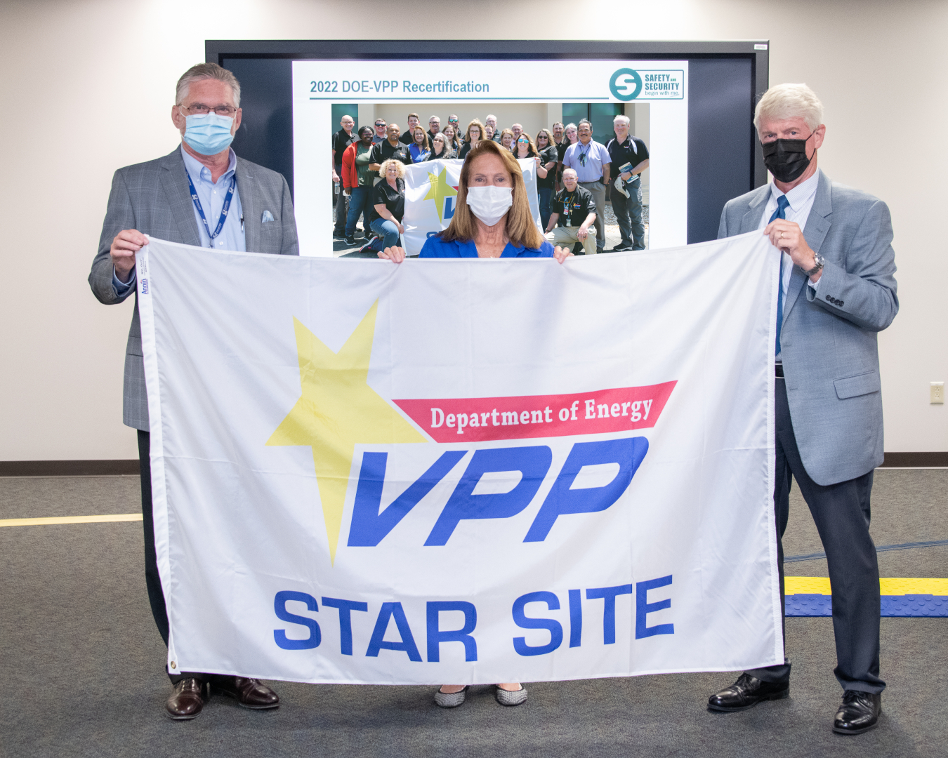 Savannah River Operations Manager Michael Budney, right, presented Savannah River Nuclear Solutions (SRNS) President and CEO Stuart MacVean and SRNS Safety Programs and Employee Engagement Lead Barbara Guenveur with the company’s fourth consecutive DOE Voluntary Protection Program Star status in August.