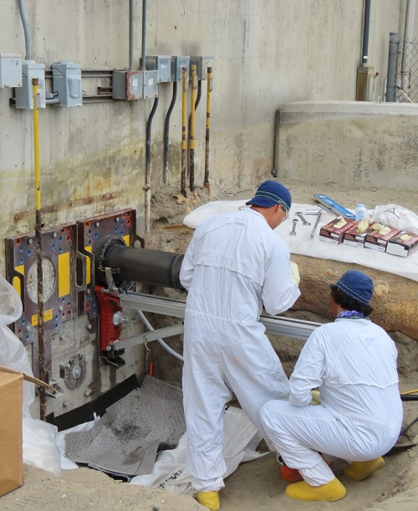 Washington River Protection Solutions workers install three new wall nozzles connecting new transfer lines to the 242-A Evaporator pump room on the Hanford Site.