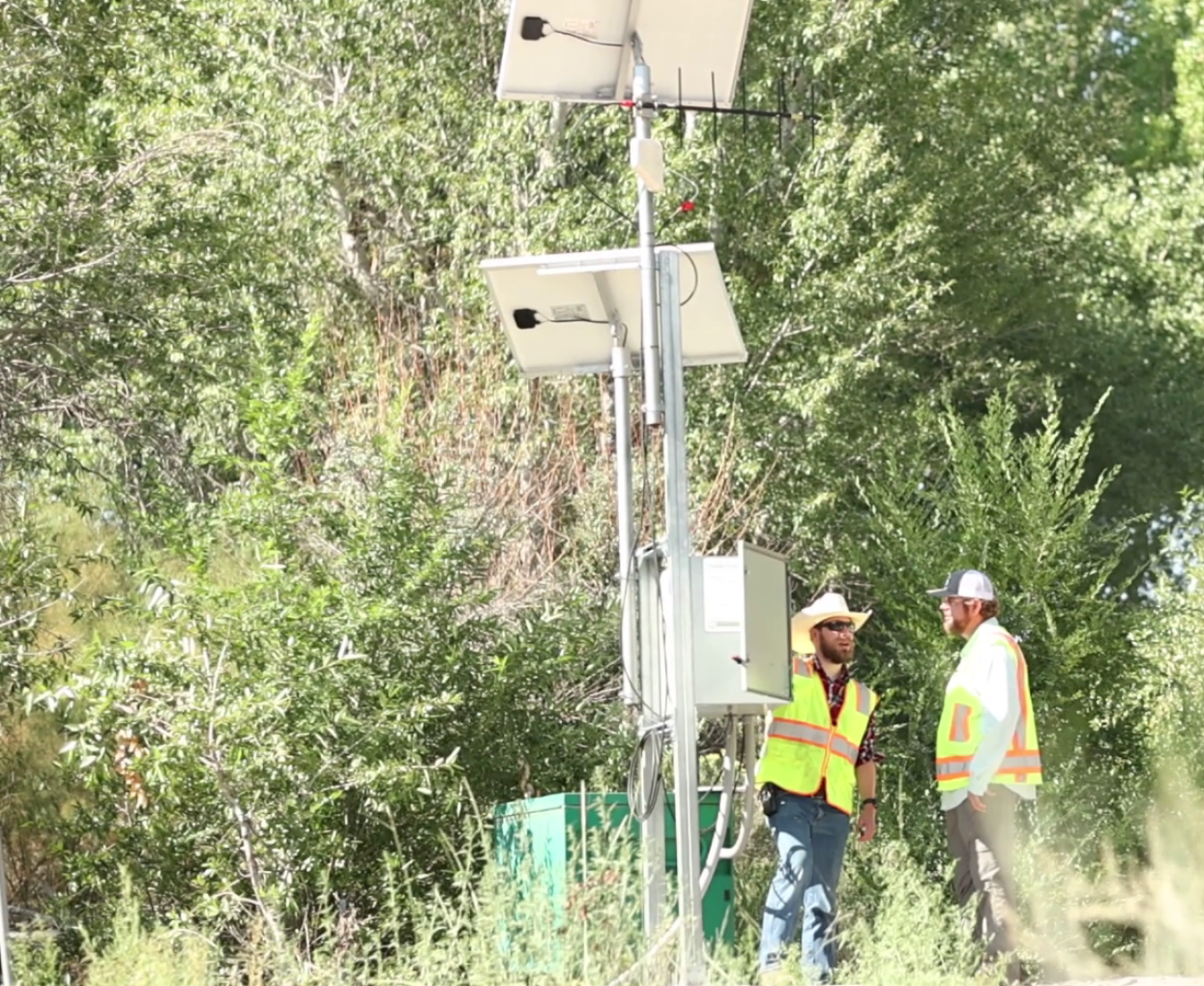 Russell Lyon and John Mumm, with one of Newport News Nuclear BWXT-Los Alamos’s subcontractors, Tech2 Solutions, inspect a new streamflow gaging station recently installed at the confluence of Los Alamos Canyon and the Rio Grande. The gaging station transmits flow and no-flow information to the Buckman Direct Diversion’s Operations Center and the Pueblo de San Ildefonso.