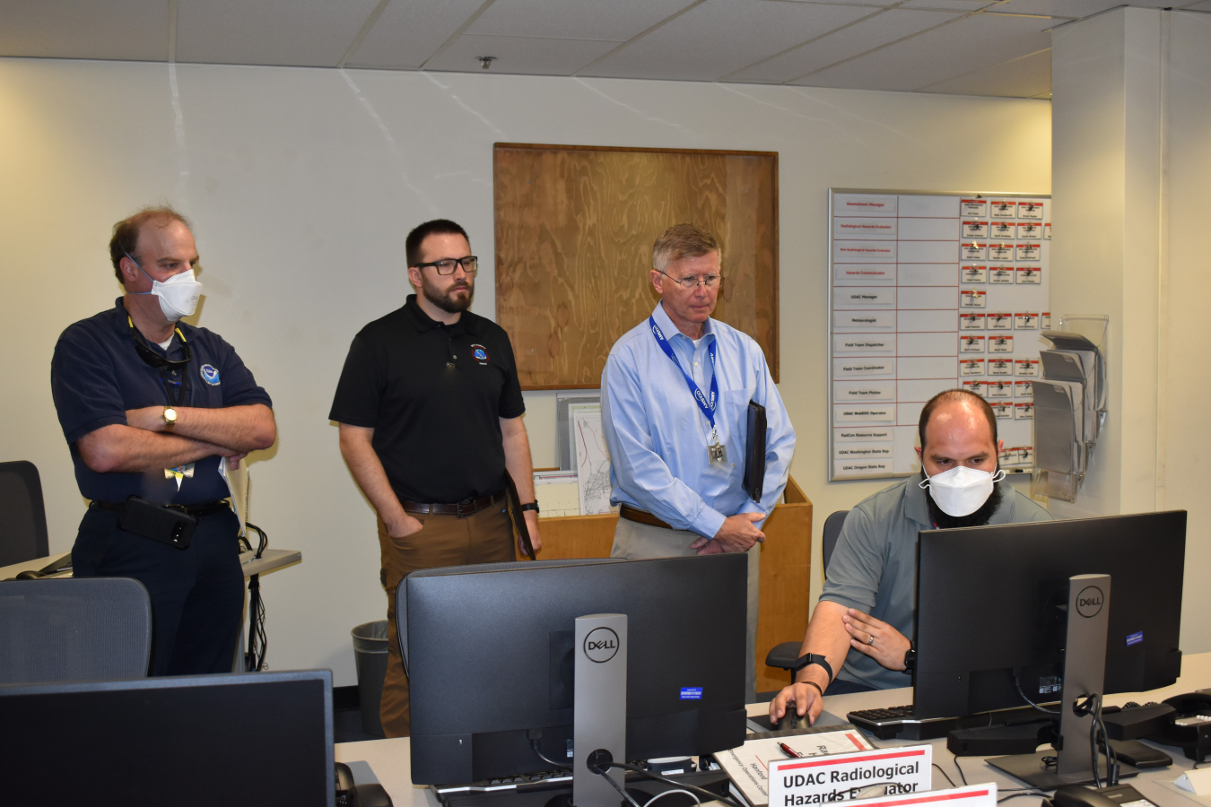 National Weather Service meteorologists view weather model capabilities available to Hanford Mission Integration Solutions Meteorologist Grant Gutierrez at the Hanford Site’s Emergency Operations Center.