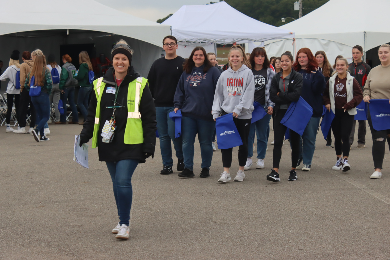 Portsmouth Site Engineer Ellen Stone, the Science Alliance director, leads students from Jackson City Schools in Breathitt County to one of the 14 science stations at the event.