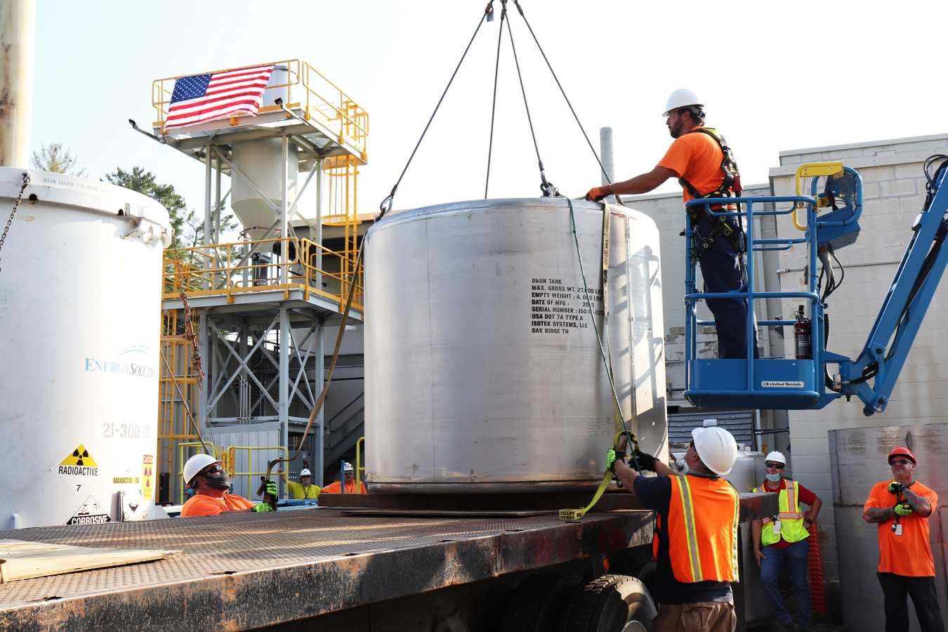 Workers are pictured installing new equipment essential to the downblending process, which is now underway.