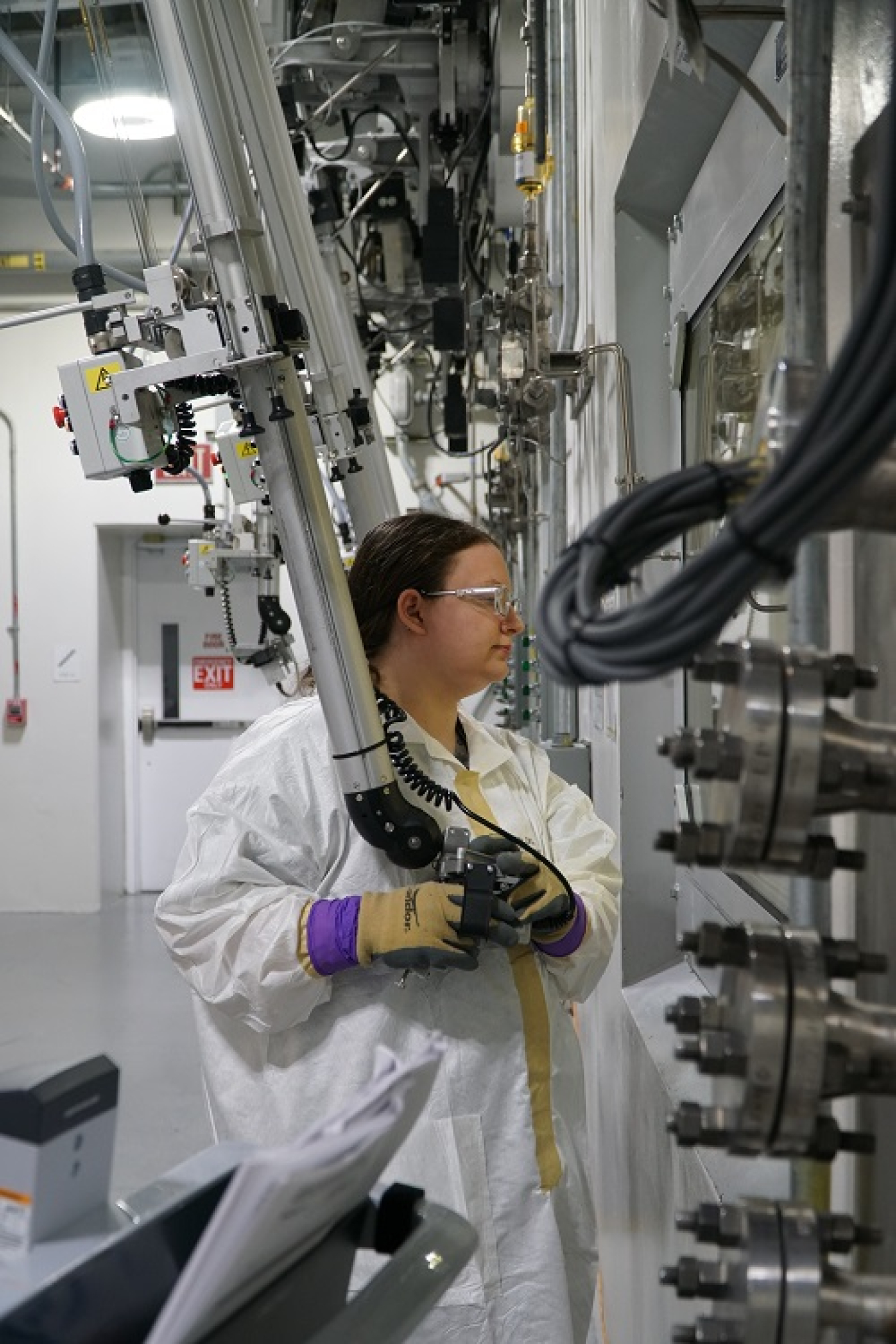 Salt Waste Processing Facility (SWPF) lab technician Jennifer Zimmerman operates a manipulator to maneuver radioactive samples in Savannah River Mission Completion’s SWPF laboratory.