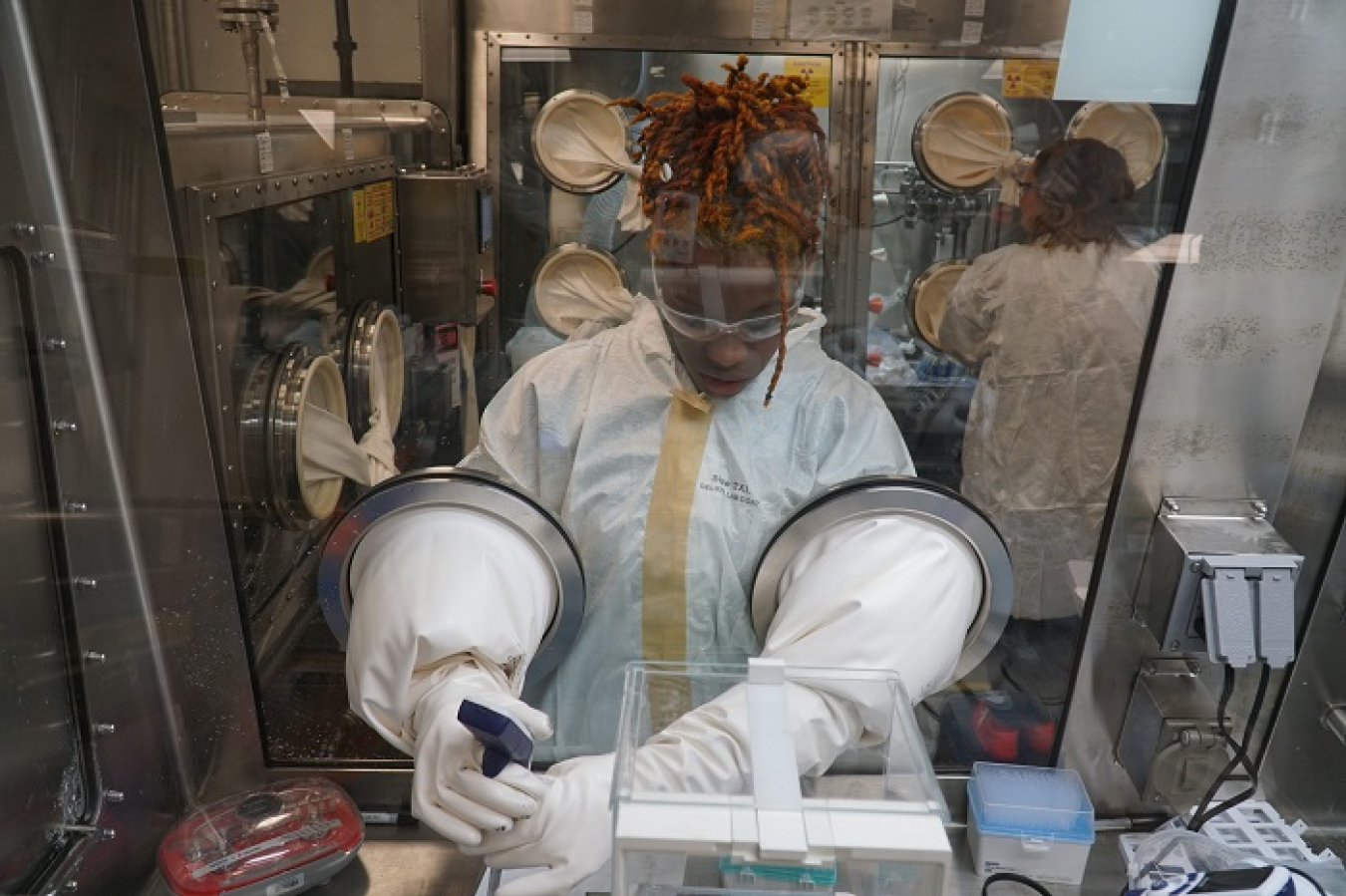 Salt Waste Processing Facility (SWPF) lab technician Dorian Carter analyzes samples using a glovebox in Savannah River Mission Completion’s SWPF laboratory.