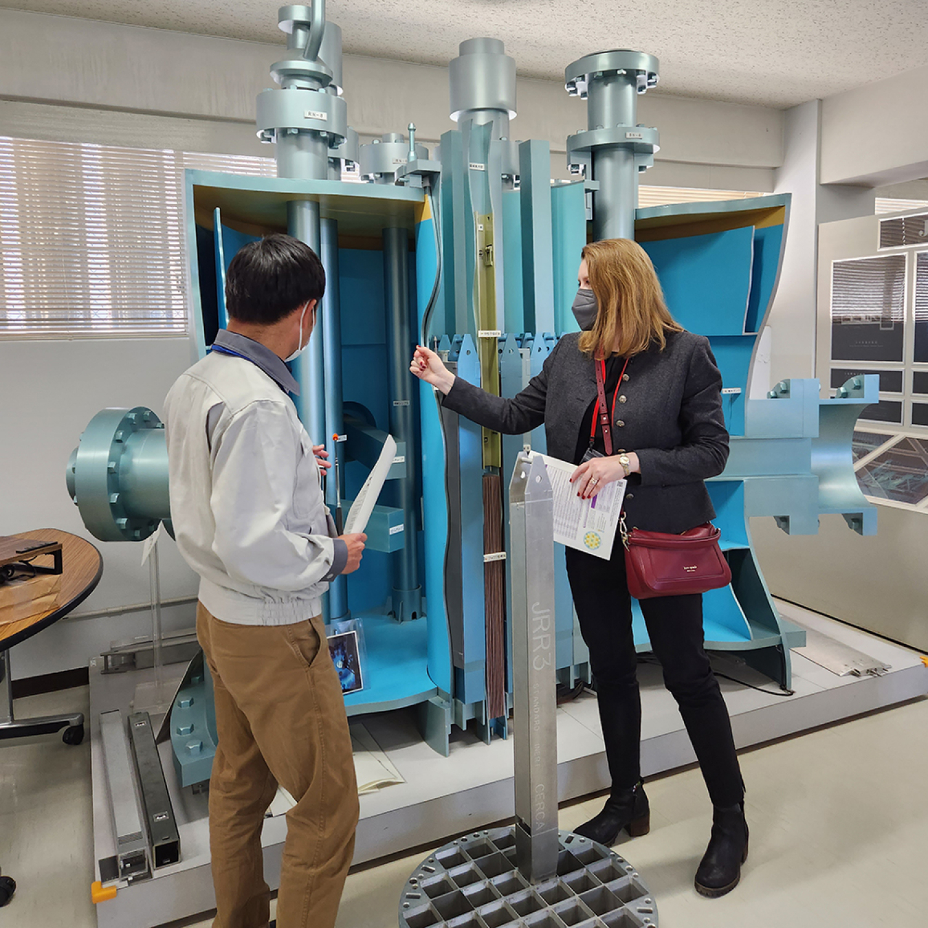 Corey Hinderstein is shown the reactor mock-up.