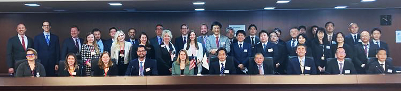 A large group of NSWG participants standing in front of a table.