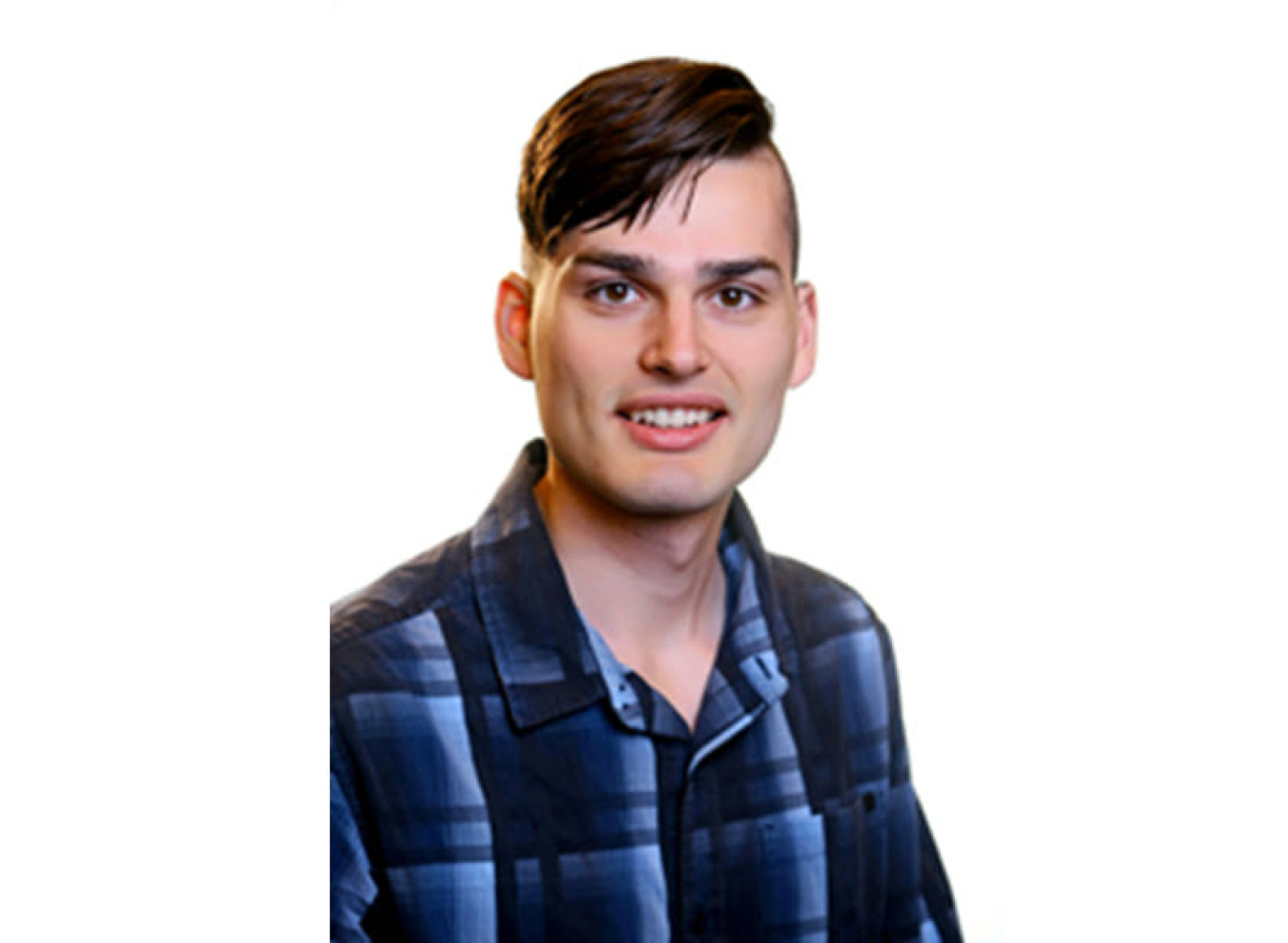 Headshot photo of young man wearing blue and grey checked shirt. He is smiling at the camera.