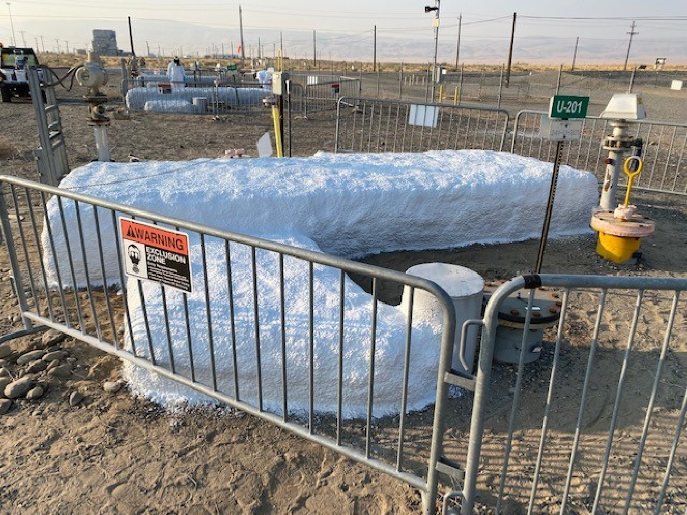 Equipment at U Farm on the Hanford Site is covered in foam insulation as crews prepare to install an asphalt surface barrier. Barrier construction is expected to begin next year. 