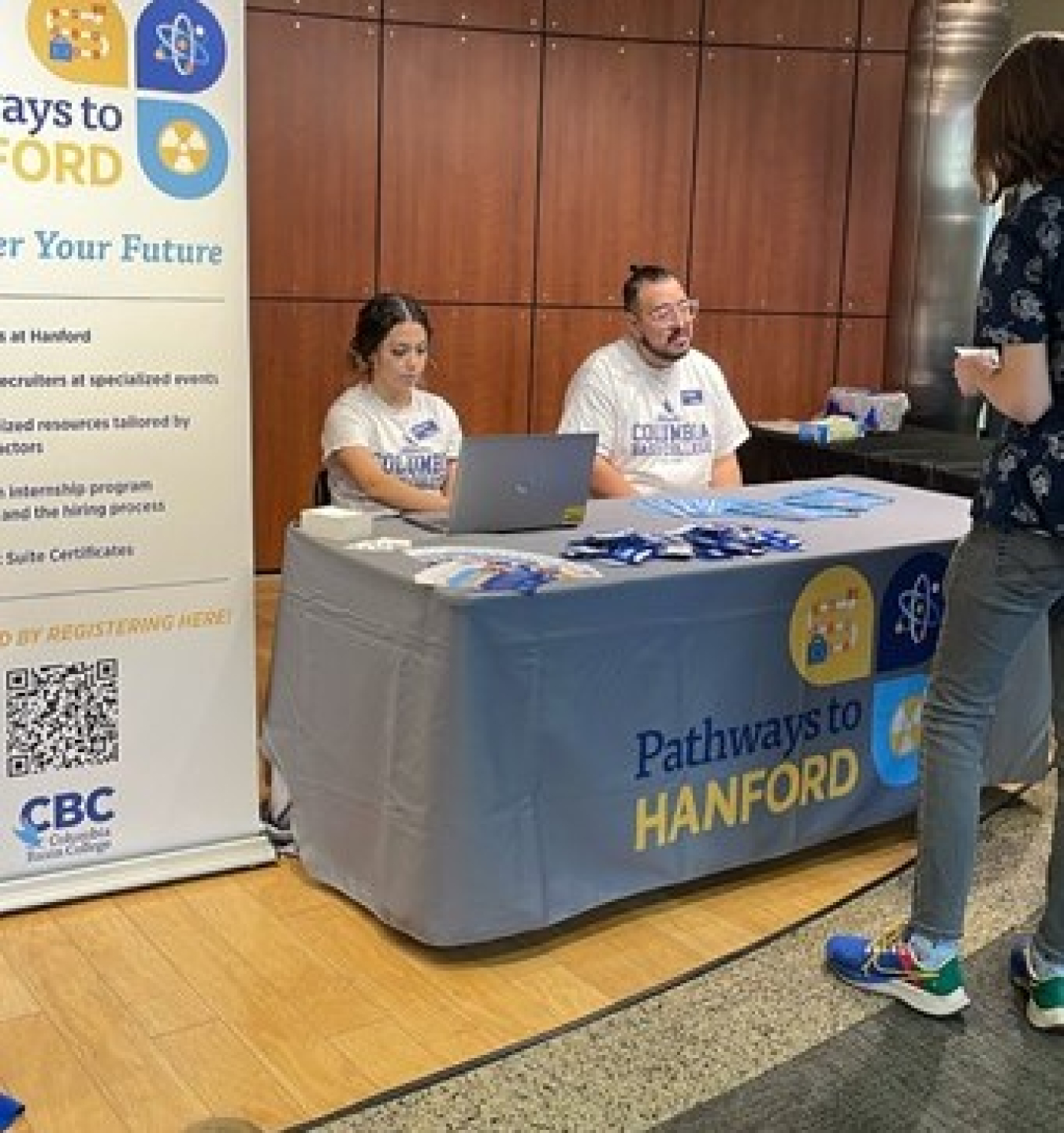 Career Services team members at Columbia Basin College talk with a student at a recent event to recruit students for the Pathways to Hanford program