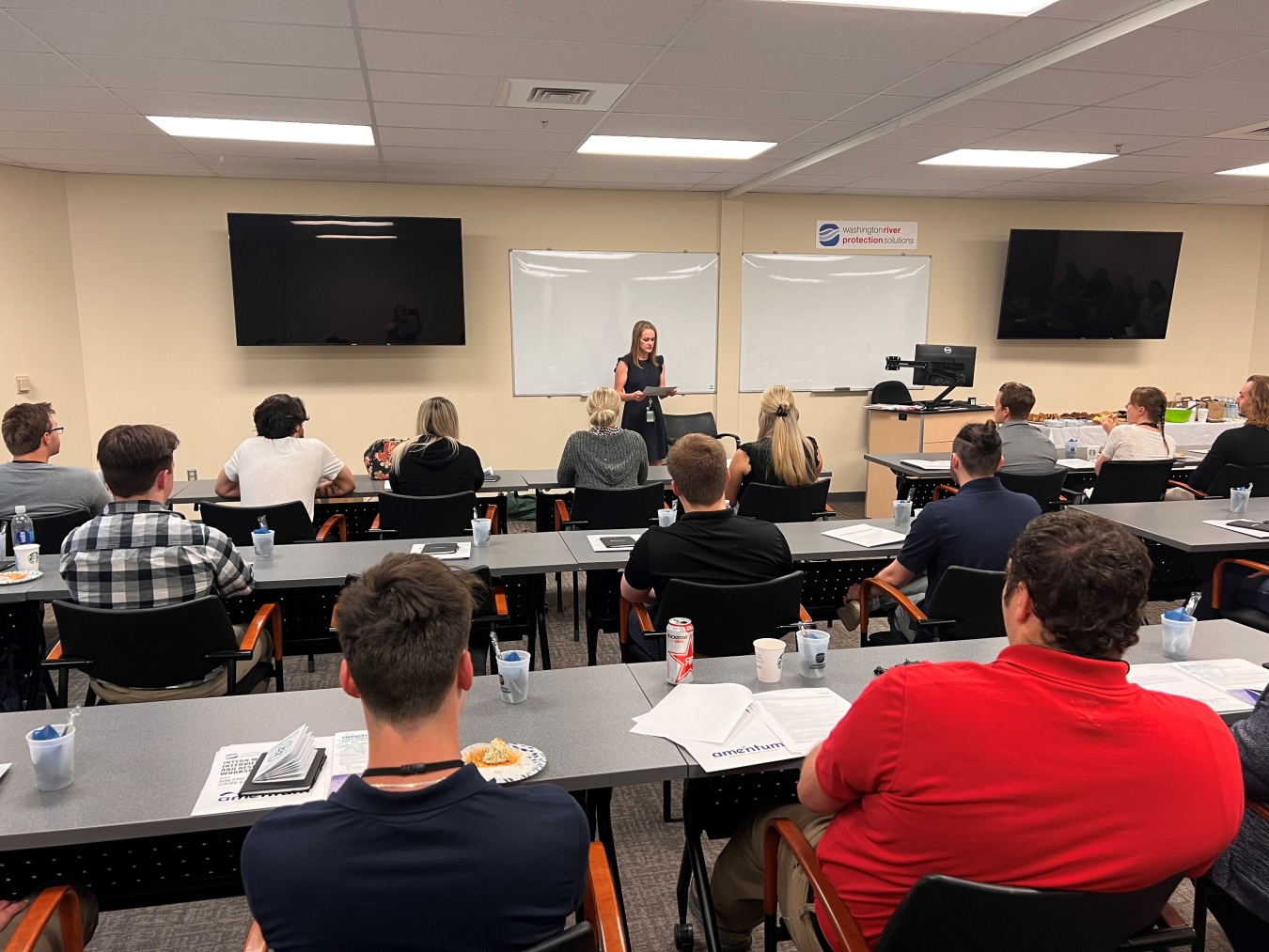 Washington River Protection Solutions Workforce Resources Manager Amy Hayfield speaks to a group of students in July taking part in summer and cooperative internships. 