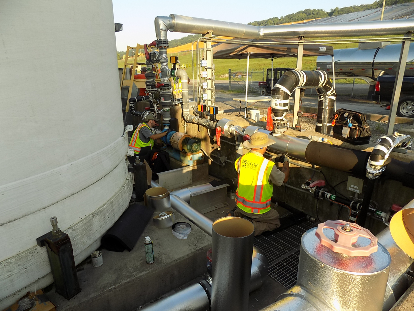 UCOR employees Andy Rodgers, left, and Alex Johnson install heat tracing to protect systems at the Environmental Management Waste Management Facility during the cold snap in Oak Ridge. Temperatures did not reach above freezing for more than four consecutive days.