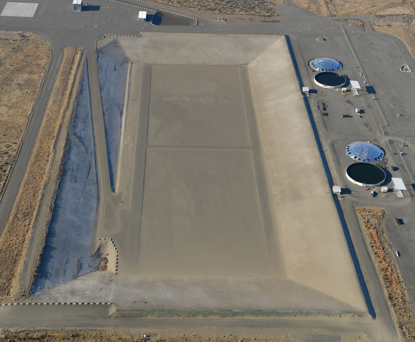 The Integrated Disposal Facility on the Hanford Site is designed to receive containers of vitrified, or immobilized in glass, low-activity waste from Hanford’s underground storage tanks, and mixed low-level waste from other site operations.