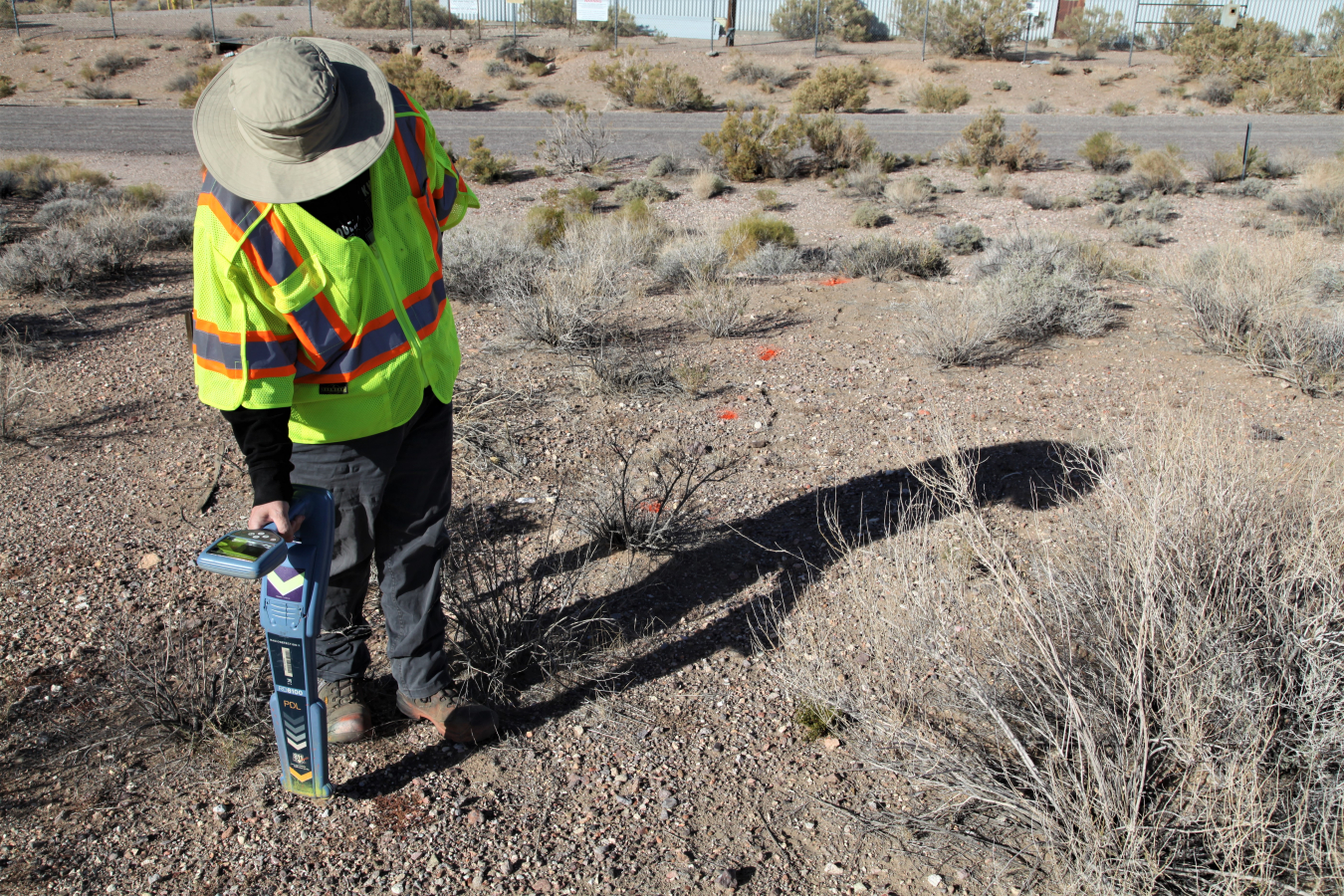 Geophysicist Beth Williams uses paint drops to mark responses from the passive locator.