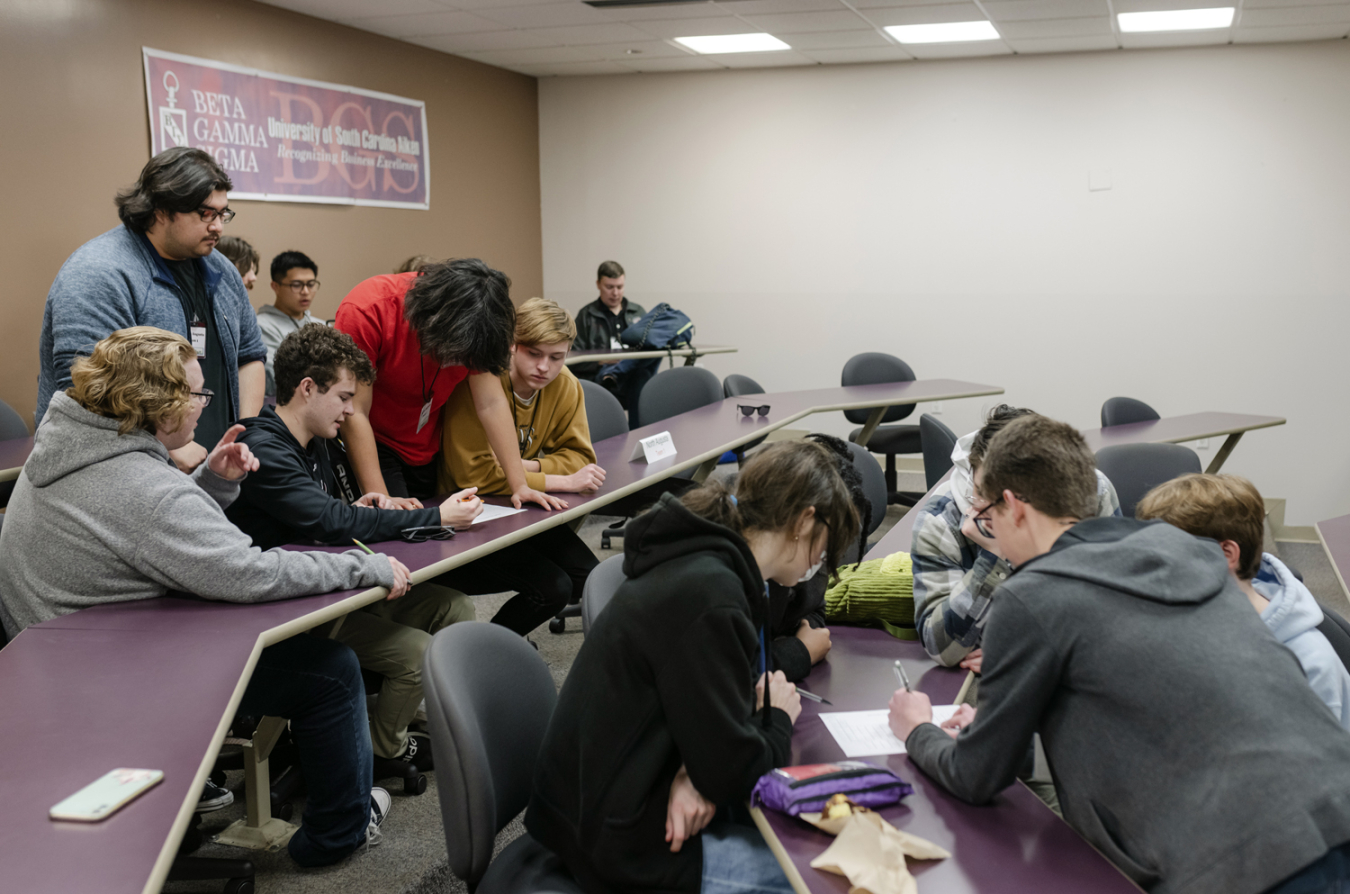 Three DOE Science Bowl teams compete during a brain teaser activity to earn prizes for their teachers. Five team members from North Augusta High School in North Augusta, South Carolina, left, strive to win the round while members of Dorman High School in Spartanburg, South Carolina, right, race to defeat them.