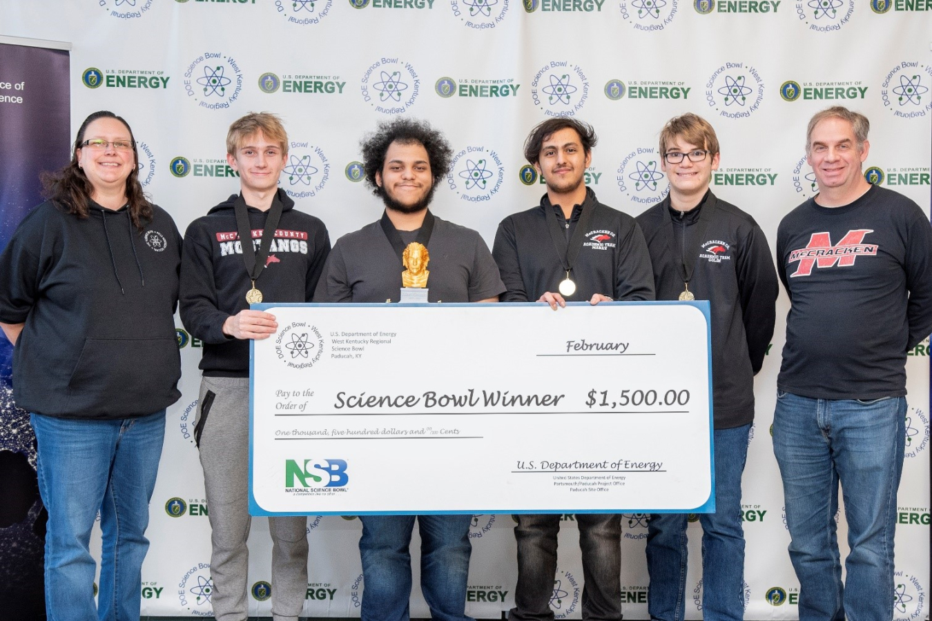 McCracken County High School won the DOE West Kentucky Regional Science Bowl. Pictured from left are EM Acting Paducah Site Lead April Ladd, Garret Greenwell, Cole Cannon, Manav Shah, Colin McCurren and McCracken County High School coach Matthew Shelton. Not pictured: Owen Cody.