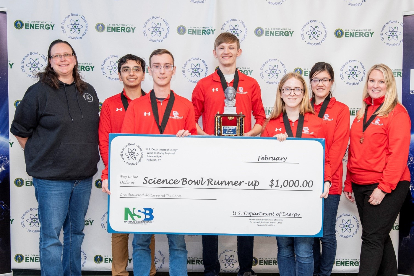 Calloway County High School took second place in the DOE West Kentucky Regional Science Bowl. Pictured from left are EM Acting Paducah Site Lead April Ladd, Aary Patel, Ethan Cain, Isaac Martin, Elizabeth Lanier, Amber Wu and Calloway County High School coach Erica Gray.