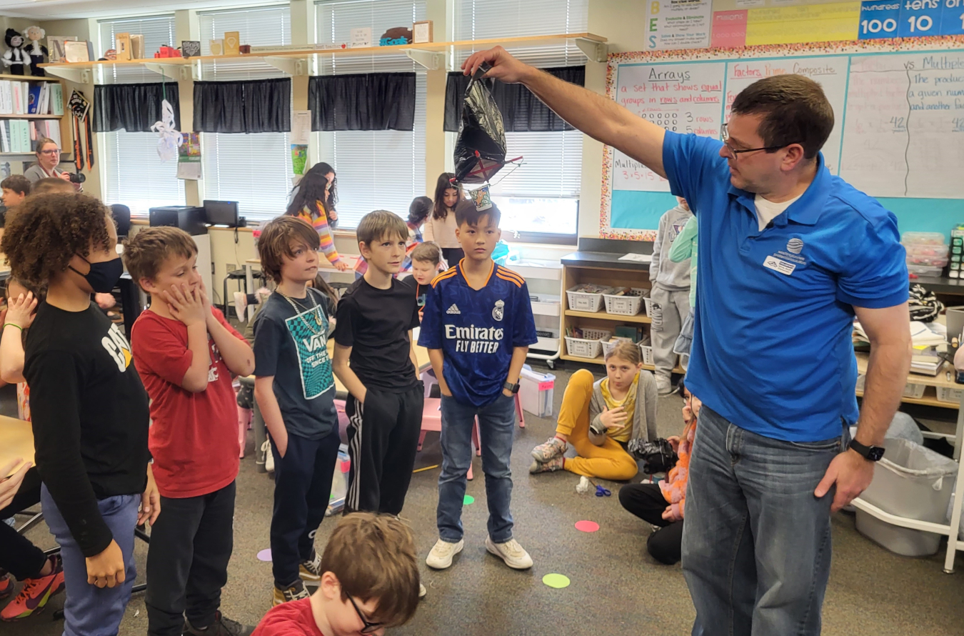 Volunteers from Hanford Site tank operations contractor Washington River Protection Solutions lead fourth-grade students in a STEM-related activity during Hanford Engineers Week.