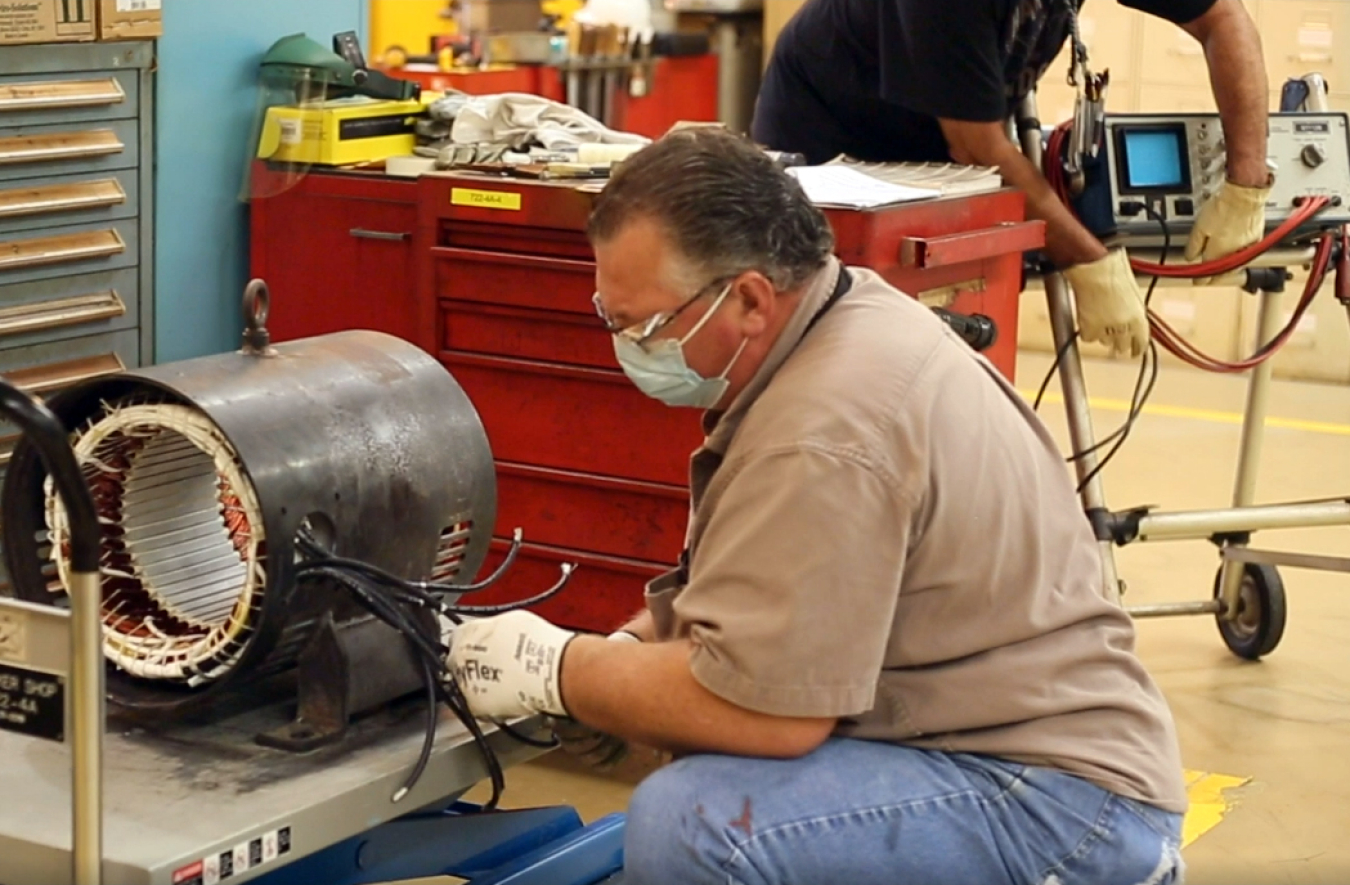 Motor Specialist James Fuller replaces long strands of copper wire — a process known as motor rewinding — found within this electric motor for the EM program at Savannah River Site. Motor rewinding is a maintenance skill difficult to find in the U.S. workforce, according to Savannah River Nuclear Solutions.