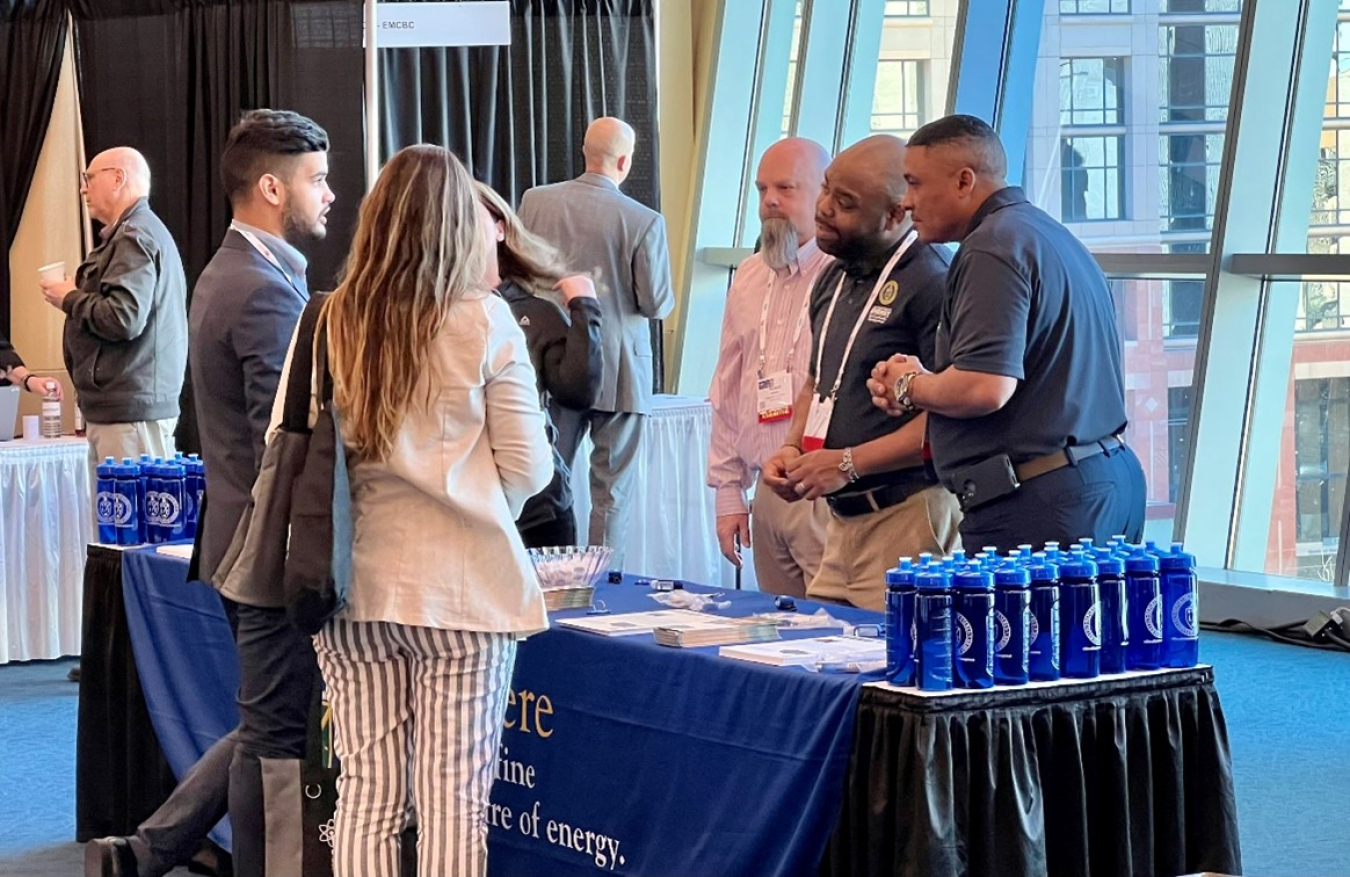 Participants in a job fair at the 2023 Waste Management Symposia in Phoenix visit a booth hosted by DOE representatives. A virtual component of the job fair is available through March 31. Register here.