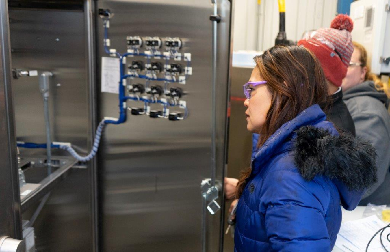 EM contractor Washington River Protection Solutions Engineer Elvie Brown examines equipment at the Plutonium Uranium Extraction Plant to learn more about the stack sampling program, as site contractors prepare for the start of tank-waste treatment under the Direct-Feed Low-Activity Waste Program.