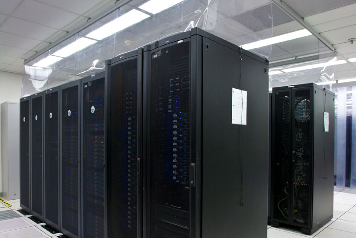 A data center room with towers and cooling systems.