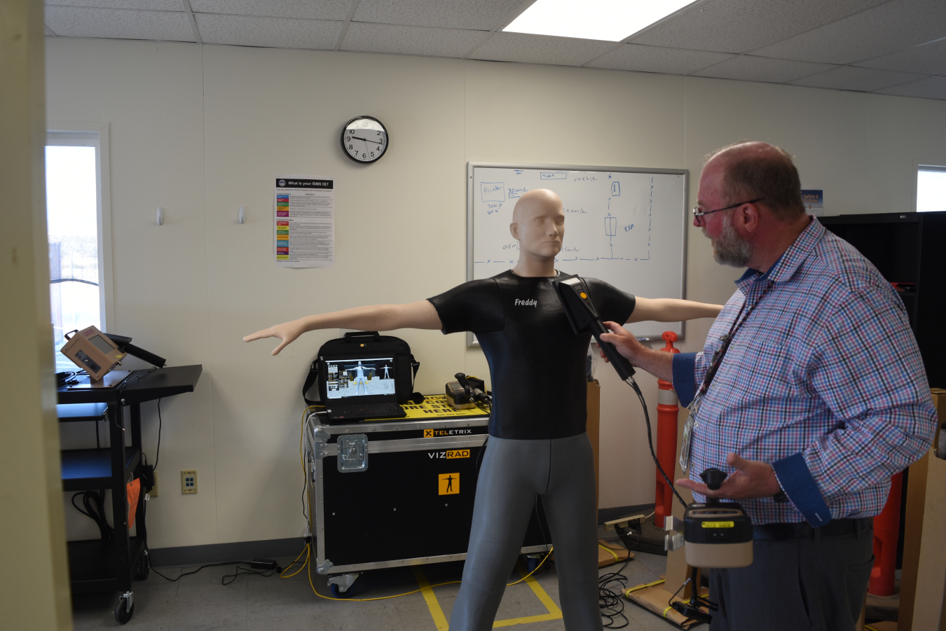 Waste Treatment and Immobilization Plant Radiological Engineer Steven Goodrich demonstrates contamination screening using the VIZRAD Frisk simulator.