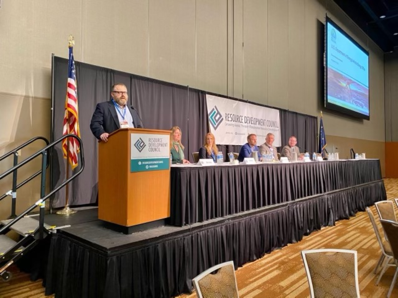 Givey Kochanowski at stage left during a panel presentation at the Resource Development Council. 