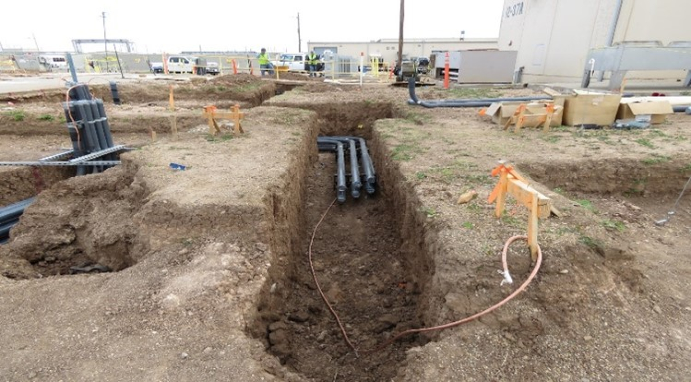 Multiple excavations performed for electrical conduit runs