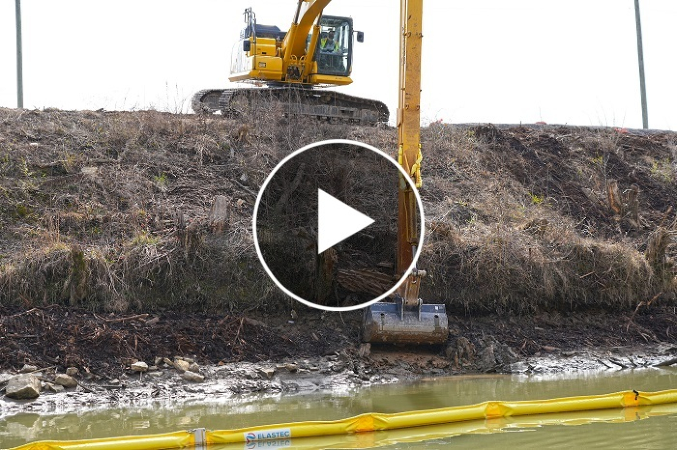 Watch this video to see crews removing transite from a portion of the Poplar Creek bank.