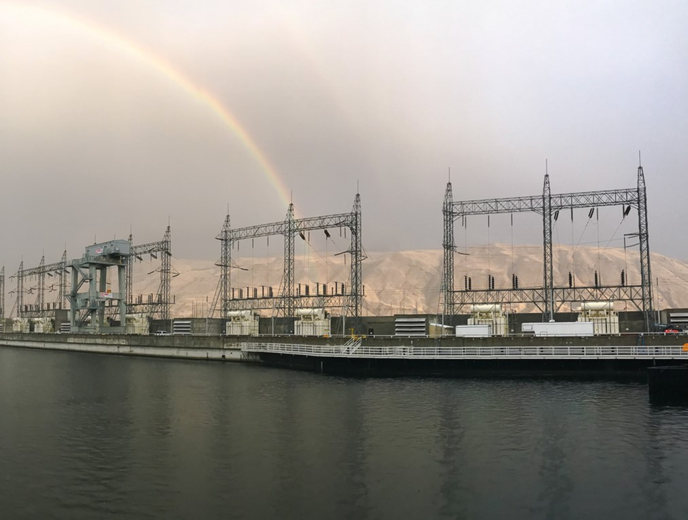 rainbow over hydropower facility