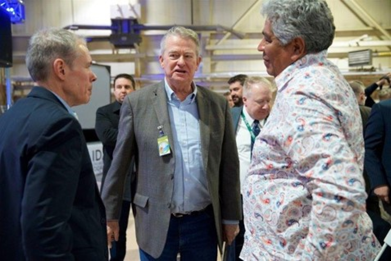 EM Senior Advisor William “Ike” White, left, greets Ladd Edmo, a member of the Fort Hall Business Council of the Shoshone-Bannock Tribes, right, and Idaho Gov. Brad Little at the celebration.