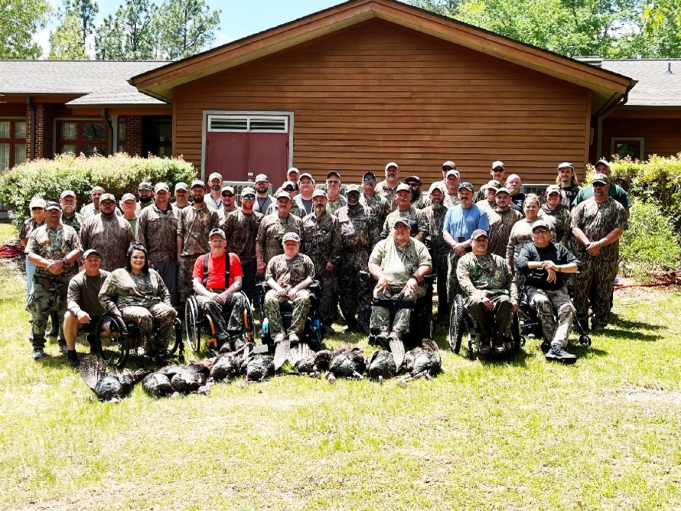 Hunters gather at the end of the first day's hunt on the Savannah River Site for a group photo.  - U.S. Department of Agriculture image.